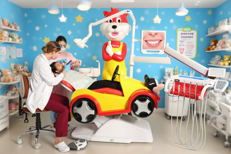 Kids in dental clinic make treatment by Q2 children dental chair.
